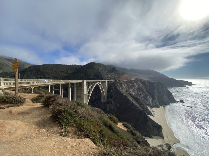 Views of the mountains in California along the Big Sur Coastline with a bridge from mountain to mountain