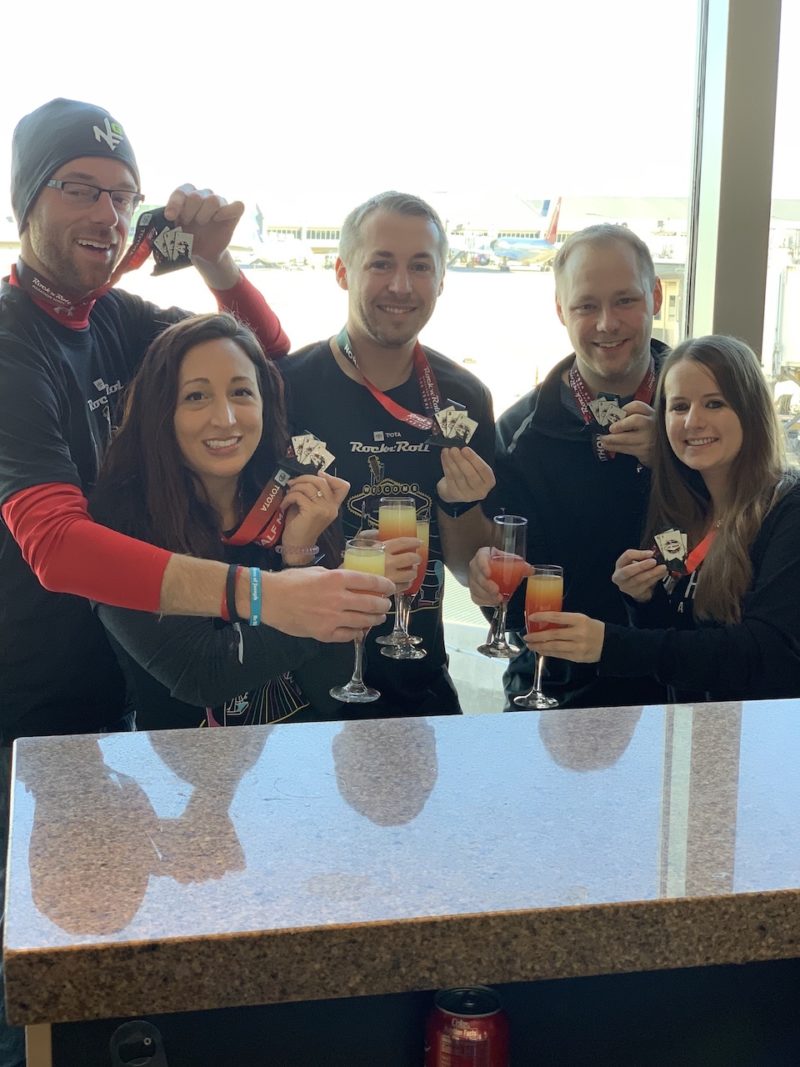 Group of friends enjoying lounge access with mimosas