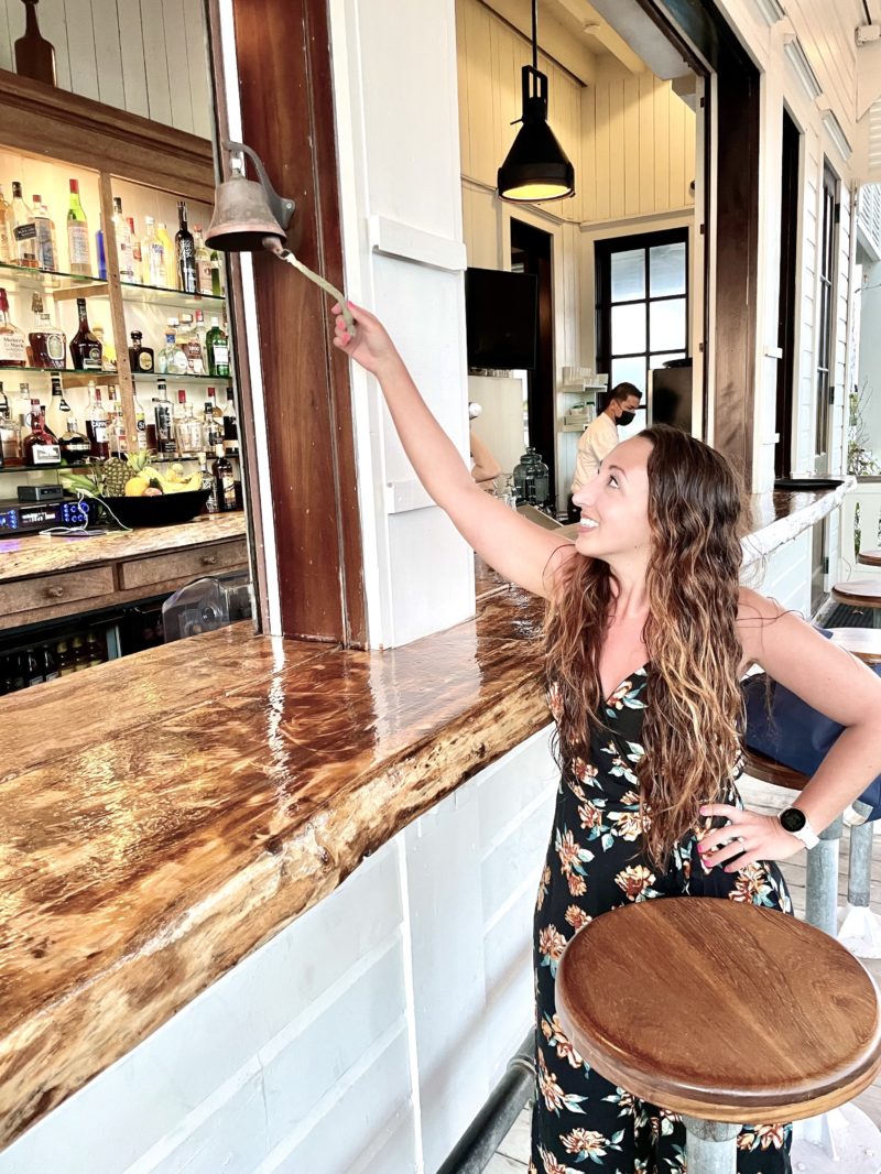 Woman ringing bell for free drink