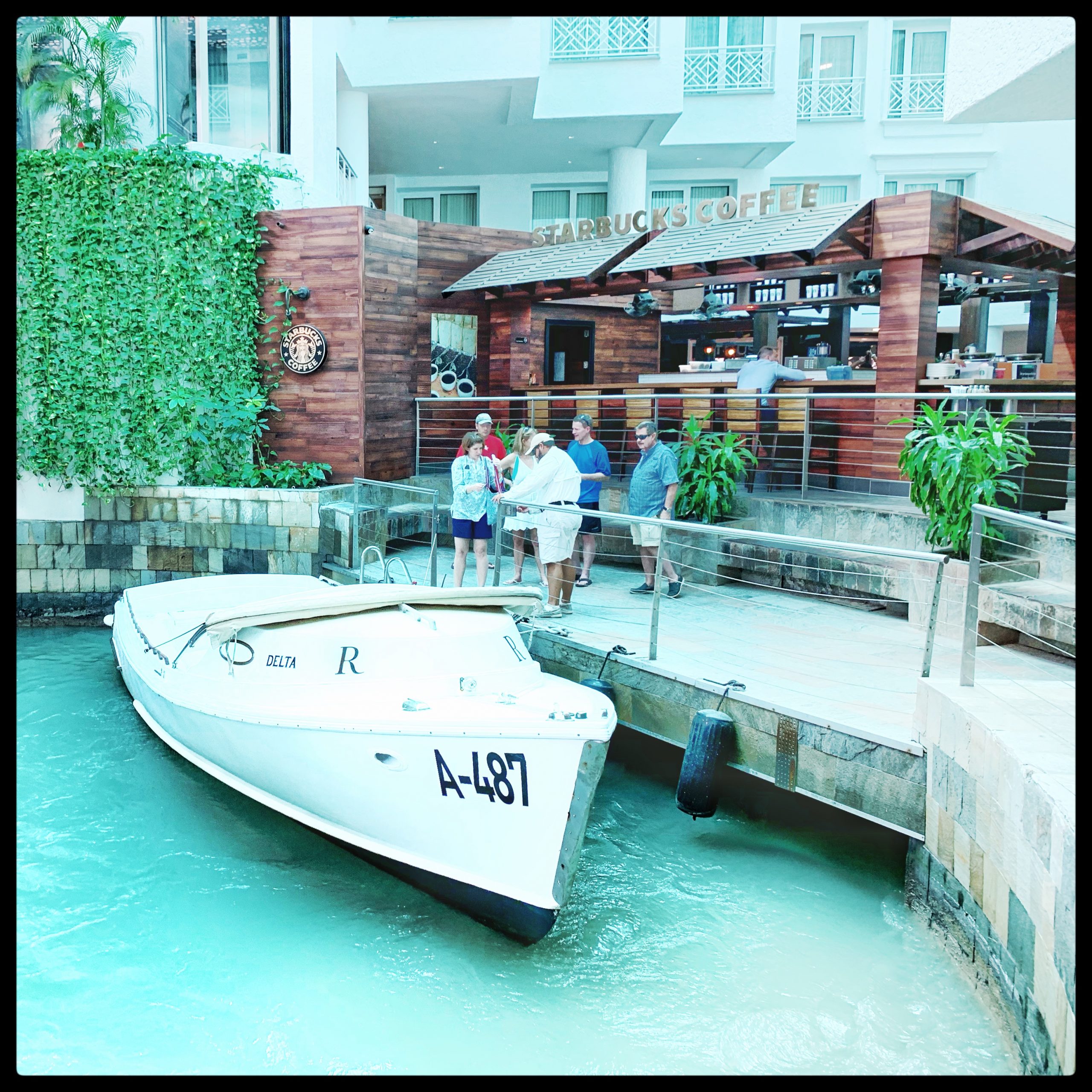 Boat at entry way to Marina Renaissance Hotel to get to Flamingo Island