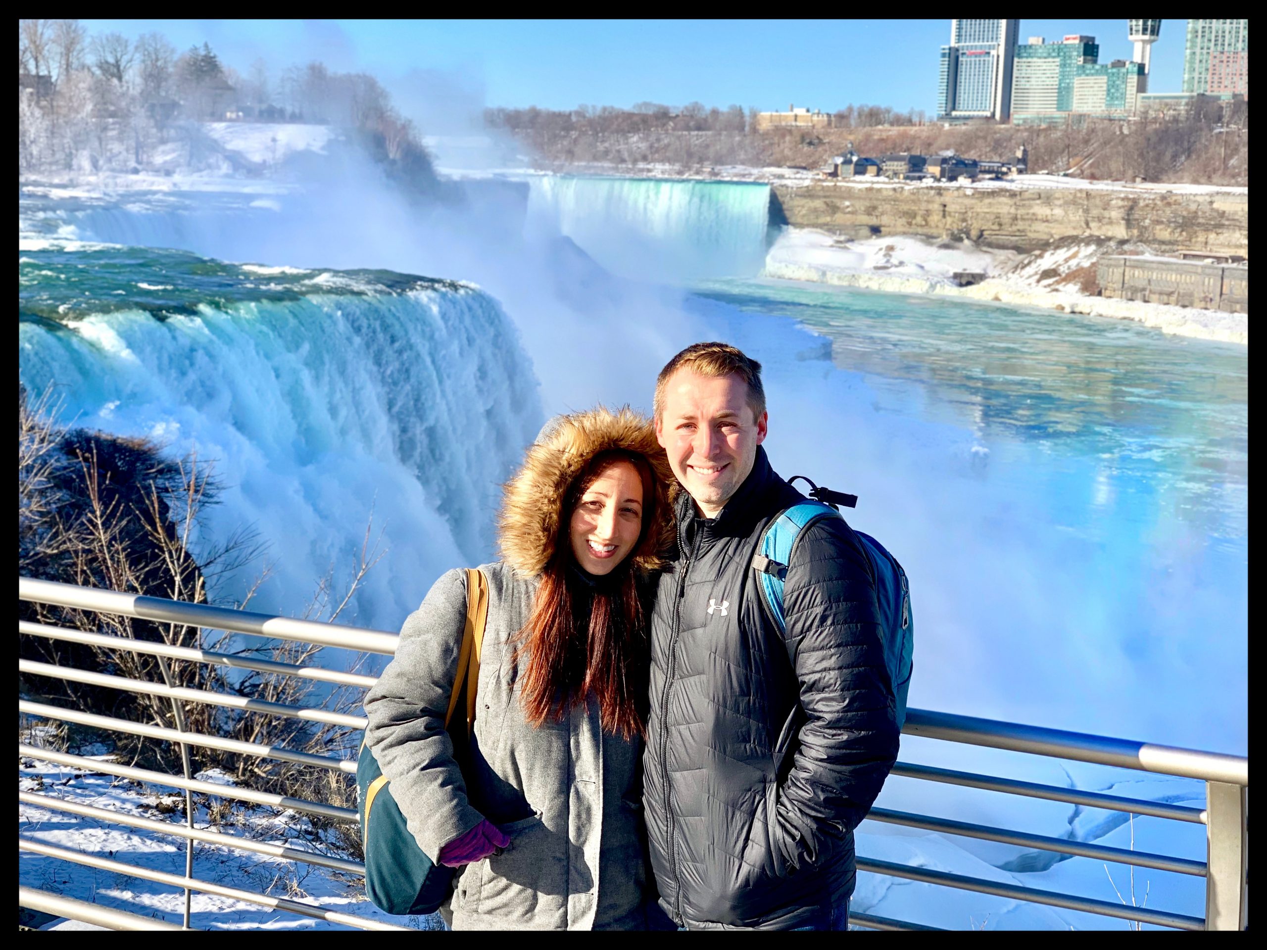 Couple posing in front of Niagara Falls American Side