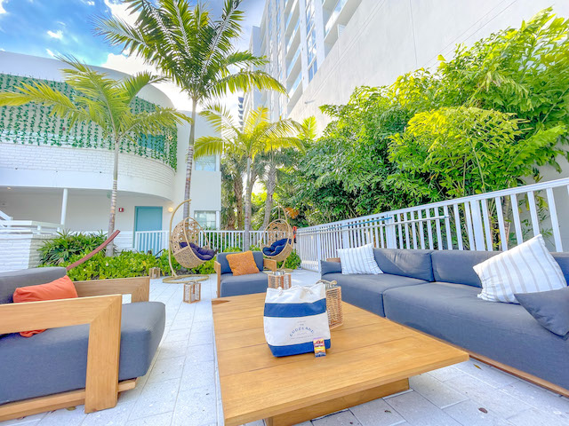 Outdoor lounge seating at Kimpton Goodland Fort Lauderdale
