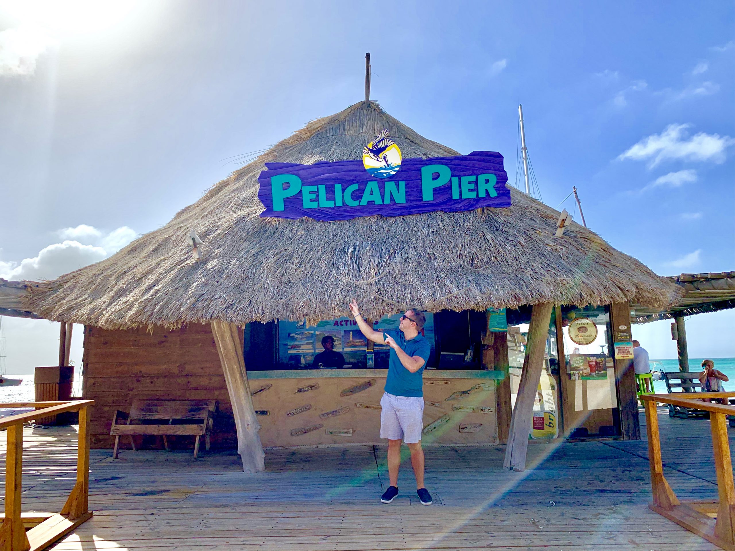 Man standing in front of Pelican Pier bar