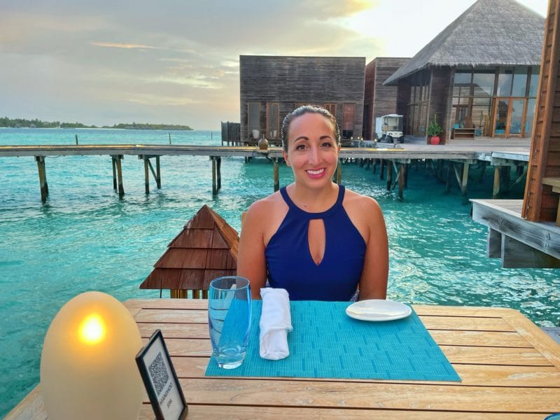 Woman at dinner surrounded by water