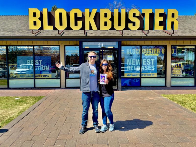 Couple standing in front of the last remaining blockbuster
