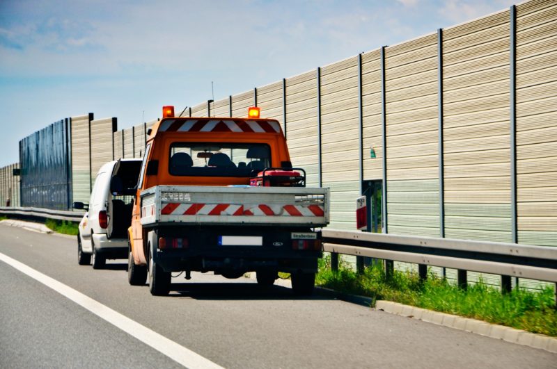 tow truck helping a car